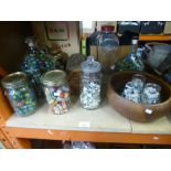 A quantity of marbles, in jars and to include vintage treen items