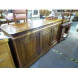 Large mahogany Chiffonier with three waist drawers, above cupboards, on bun feet