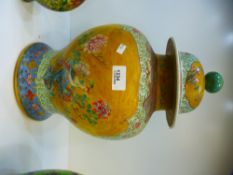 A Chinese pale blue and yellow ginger jar, having pair of panels decorated bird and foliage, 42 cms,