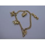 9ct yellow gold charm bracelet with heartshaped padlock, marked 375, hung with 4 charms, weight