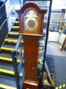 A 1930's oak shortcase clock