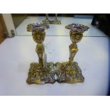 Pair of Sheffield silver table candlesticks decorated in the classical style, shaped square bases,