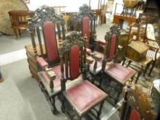 A set of eight early 20th century carved oak dining chairs to include a large pair of carvers