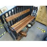 A Victorian style metal and wooden slatted bench having black painted ends, 167cms