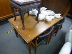 Clausen and Son; a Danish teak oblong extending dining table on turned legs, 127cms shut - and a set