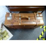 An old leather suitcase having an expanding lid, 66 cms