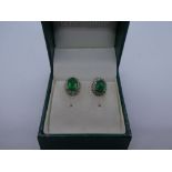 Pair 9ct emerald and diamond chip cluster earrings, in box, marked 9