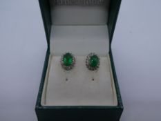 Pair 9ct emerald and diamond chip cluster earrings, in box, marked 9