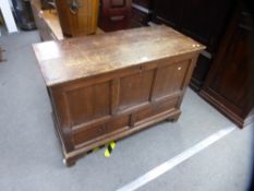 An antique stained pine linen chest having two drawers on bracket feet, 117 cms