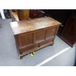 An antique stained pine linen chest having two drawers on bracket feet, 117 cms