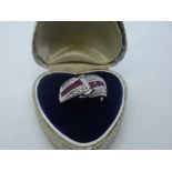 Modern 9ct white gold ruby and diamond crossover ring, marked 375, size Q/P