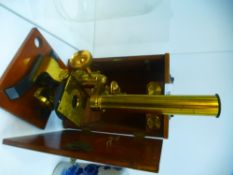 A Victorian brass microscope in fitted mahogany case