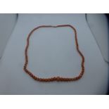 Vintage string of Coral beads, with 9ct gold clasp