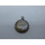 Vintage circular silver pendant, set with butterfly wing