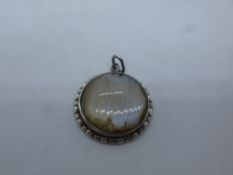 Vintage circular silver pendant, set with butterfly wing