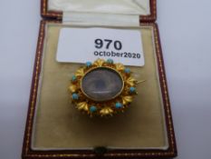 Pretty yellow metal filligree and turquoise set circular mourning brooch in tooled red leather box