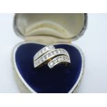 18ct two tone gold crossover ring set with 23 diamonds, size P, weight approx 4.6g, marked 750