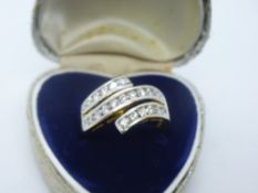 18ct two tone gold crossover ring set with 23 diamonds, size P, weight approx 4.6g, marked 750