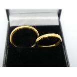 Two 22ct yellow gold wedding bands, marked 22, weight approx 6.6g