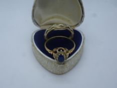 9ct gold dress ring, set with a blue Sapphire, together with a 9ct gold eternity ring, gross