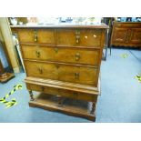 A late 19th/early 20th century chest on stand, having rosewood crossbanding and inlaid top, on