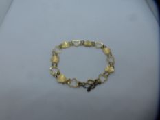 Pretty 9ct yellow gold bracelet of heart design with safety chain, total weight approx 4g