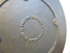 Robert Welch; a cast iron circular plate, 30 cms