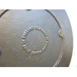 Robert Welch; a cast iron circular plate, 30 cms
