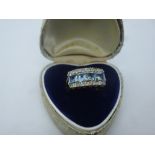 9ct yellow gold ring set with four square cut aquamarines, flanked with diamond chips, marked 375,