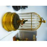 A 20th century automaton of bird in cage, with glass dome