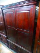 A modern mahogany style two door wardrobe with two lower drawers, 122 cms