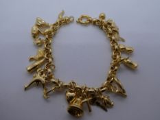 9ct yellow gold charm bracelet, containing many yellow metal charms, weight approx 17g