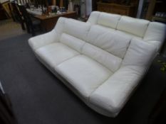 Two similar modern cream leather settees, on chrome legs, the largest 222 cms