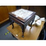 A Chinese hardwood square jardiniere stand having pierced frieze, with marble top, 42 cms