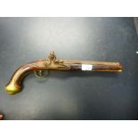 An early 19th century flintlock pistol with blanked off barrel