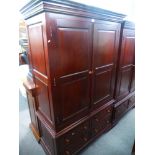 A modern mahogany style two door wardrobe, having four lower drawers, 121 cms