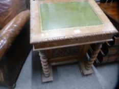 A late Victorian carved oak Davenport, having four drawers on barley twist supports, 59 cms