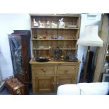 An old pine dresser and rackback having two drawers, 129 cms
