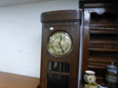 A 1930's oak longcase clock, having circular dial, 205 cms
