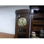 A 1930's oak longcase clock, having circular dial, 205 cms