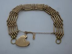 Yellow metal gatelink bracelet with 9ct yellow gold heart shaped padlock, total weight approx 20g