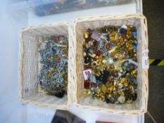 Two wicker baskets of mixed costume jewellery