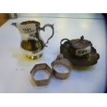 A silver lot comprising of napkin rings, milk jug, salt and trinket dish. Napkin rings, one