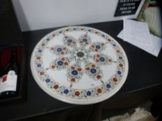 A modern circular marble top decorated flowers, 58.5 cms