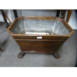 An antique Georgian period mahogany wine cooler, lead lined on paw feet, 61.5 cms