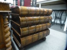 A reproduction hardwood chest of four drawers in form of stacked books on turned feet, 63.5 cms