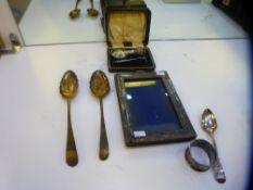 A silver lot comprising of silver gilt spoons, photoframe, napkin ring, spoon and cased baby's spoon