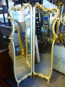 A cream and gilt two section dressing mirror with bevelled glass, 94 cms