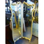 A cream and gilt two section dressing mirror with bevelled glass, 94 cms