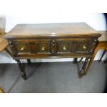 An old oak dresser base having two drawers on turned front legs, 105 cms